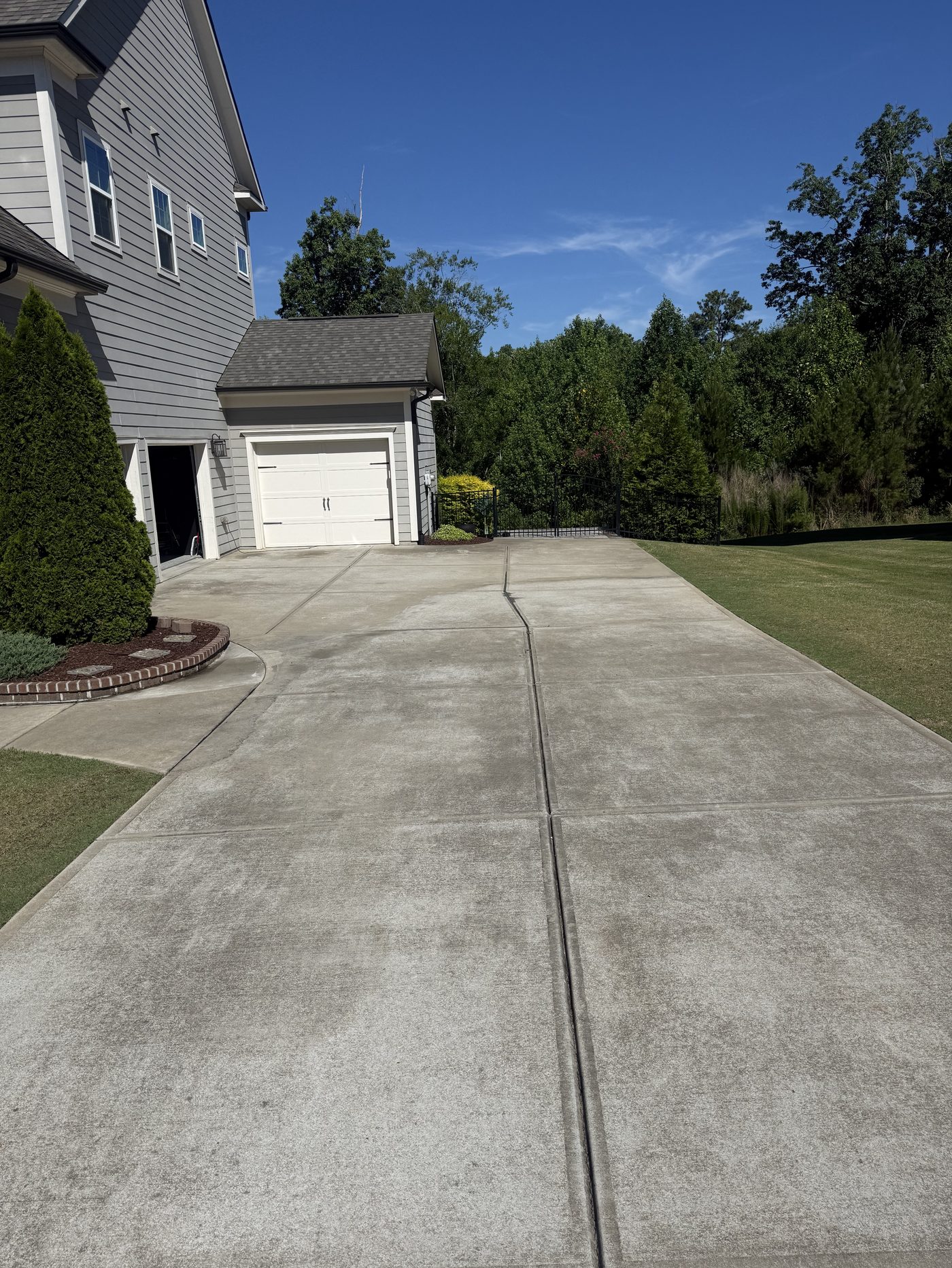Driveway before pressure washing